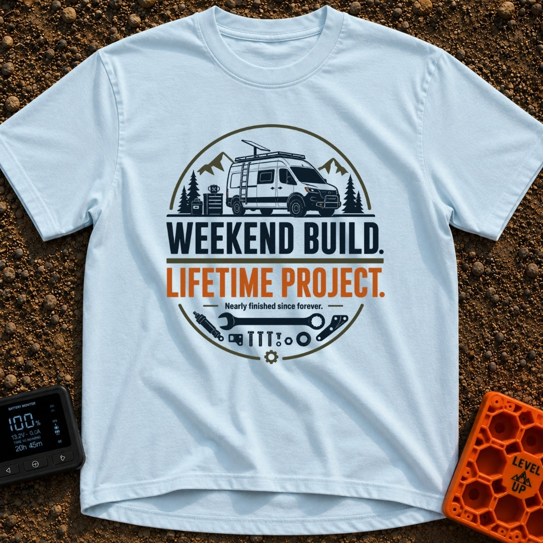 Lifetime Weekend Build - T-Shirt in Chambray - A circular graphic showing a white camper van parked near pine trees and...