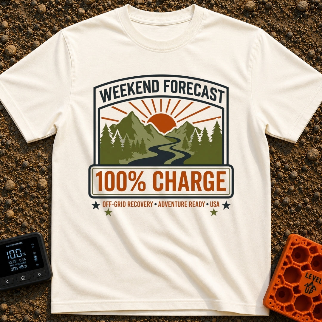 Weekend Forecast Fully Charged - T-Shirt in Ivory - A badge-style graphic showing a bright orange sun setting behind...
