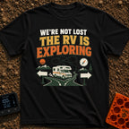 Not Lost Just Exploring - T-Shirt in Black - A Class C motorhome approaches a fork in a paved road with blank directional...