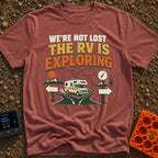 Not Lost Just Exploring - T-Shirt in Brick - A Class C motorhome approaches a fork in a paved road with blank directional...