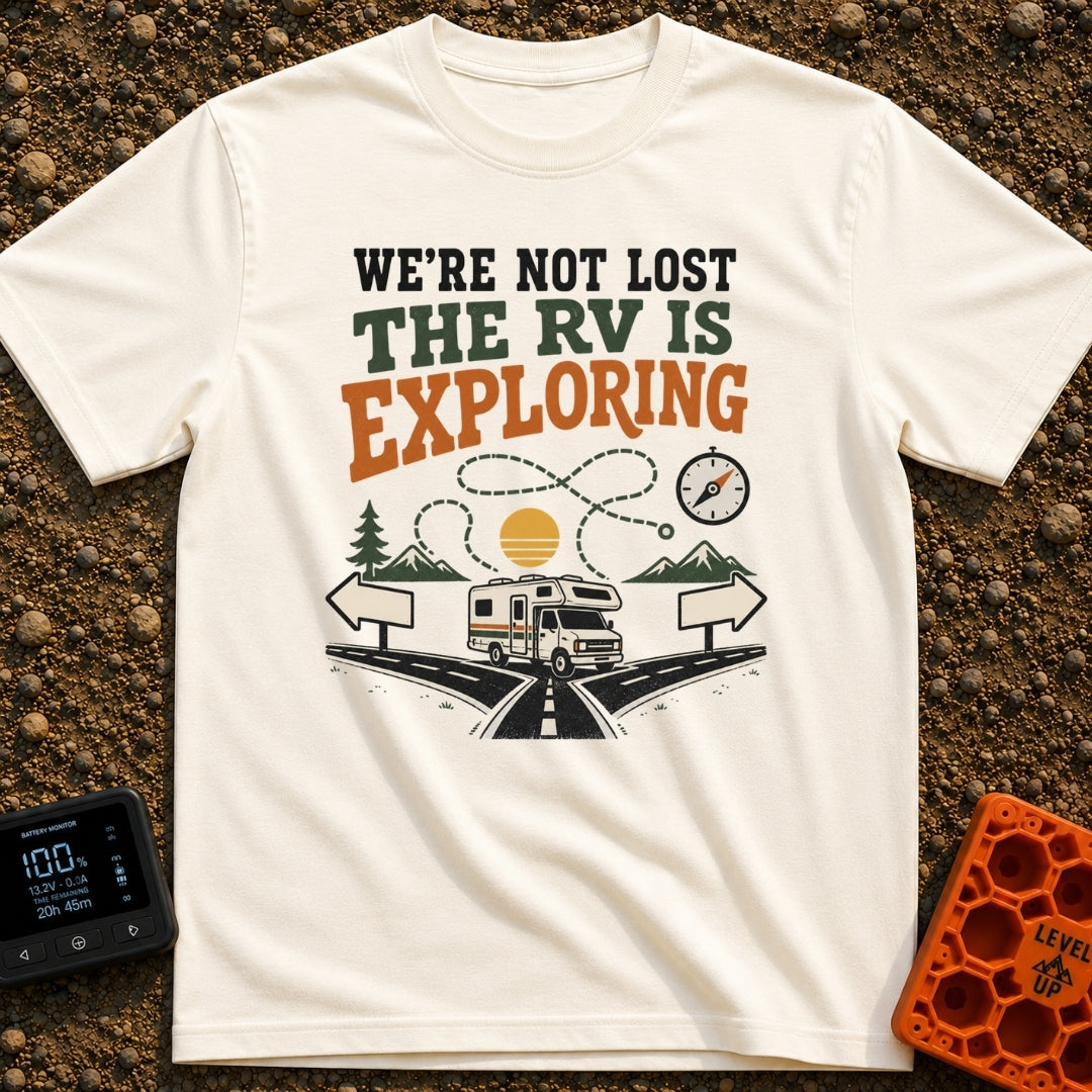 Not Lost Just Exploring - T-Shirt in Ivory - A Class C motorhome approaches a fork in a paved road with blank directional...