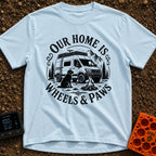 Wags On Wheels - T-Shirt in Chambray - A black and white circular illustration of a rugged camper van parked in front of...