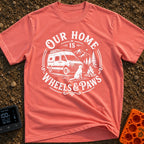 Wags On Wheels - T-Shirt in Watermelon - A black and white circular illustration of a rugged camper van parked in front...