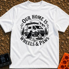 Wags On Wheels - T-Shirt in White - A black and white circular illustration of a rugged camper van parked in front of...