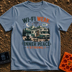 Low Bars High Zen - T-Shirt in Blue Jean - A silhouette of a woman meditating on a mat in front of an RV parked in a...