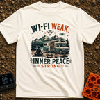 Low Bars High Zen - T-Shirt in Ivory - A silhouette of a woman meditating on a mat in front of an RV parked in a mountain...