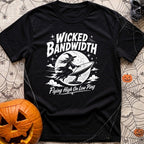 Wicked Good Bandwidth - T-Shirt in Black - A distressed white graphic featuring a silhouette of a witch flying across a...