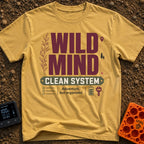 Organized Wild Wanderer - T-Shirt in Mustard - The design features the text "WILD MIND" in large burgundy letters and...