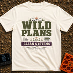 Wild Plans Clean Watts - T-Shirt in Ivory - A typographic design with the text "WILD PLANS" and "CLEAN SYSTEMS" alongside...