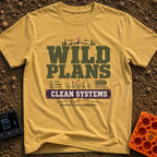 Wild Plans Clean Watts - T-Shirt in Mustard - A typographic design with the text "WILD PLANS" and "CLEAN SYSTEMS"...