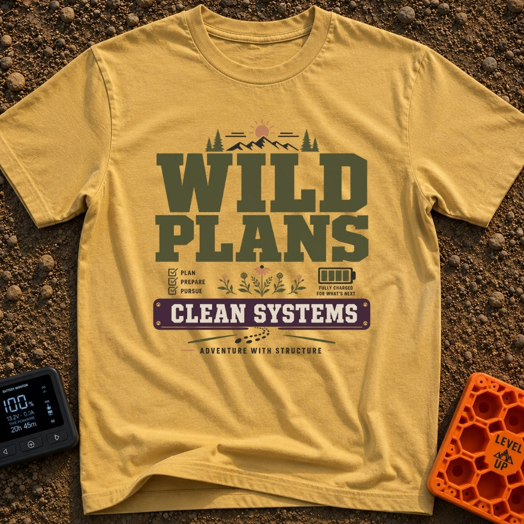 Wild Plans Clean Watts - T-Shirt in Mustard - A typographic design with the text "WILD PLANS" and "CLEAN SYSTEMS"...