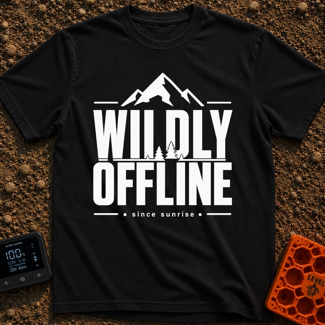 Wildly Off The Grid - T-Shirt in Black - A typographic design featuring the large bold text "WILDLY OFFLINE" with pine...