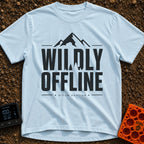 Wildly Off The Grid - T-Shirt in Chambray - A typographic design featuring the large bold text "WILDLY OFFLINE" with pine...