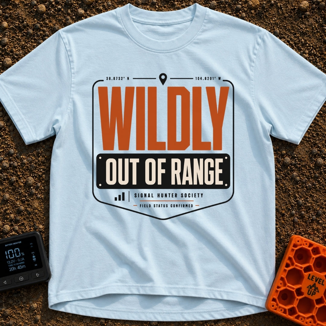 Wildly Out Of Range - T-Shirt in Chambray - A typographic badge design featuring the text 'WILDLY OUT OF RANGE' with...