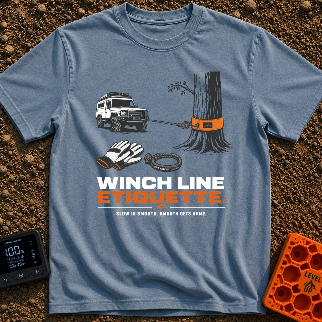 Mind Your Line - T-Shirt in Blue Jean - An illustration of a white 4x4 SUV using a front winch attached to a tree with an...