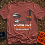 Mind Your Line - T-Shirt in Brick - An illustration of a white 4x4 SUV using a front winch attached to a tree with an...