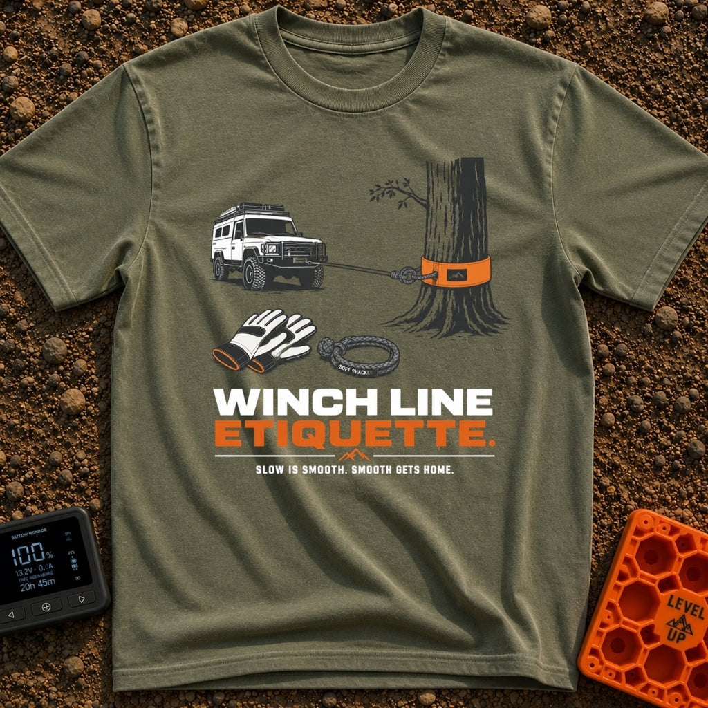 Mind Your Line - T-Shirt in Moss - An illustration of a white 4x4 SUV using a front winch attached to a tree with an...