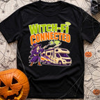 Connected To Witch Fi - T-Shirt in Black - A cartoon witch with purple hair, a purple dress, and a pointy hat points a...
