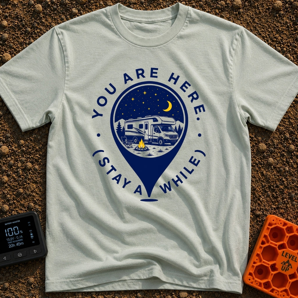 Stay Here A While - T-Shirt in Bay - A graphic of a large location map pin containing an illustration of an RV parked at...