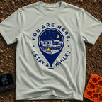 Stay Here A While - T-Shirt in Bay - A graphic of a large location map pin containing an illustration of an RV parked at...