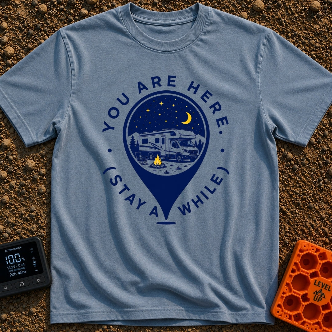 Stay Here A While - T-Shirt in Blue Jean - A graphic of a large location map pin containing an illustration of an RV...