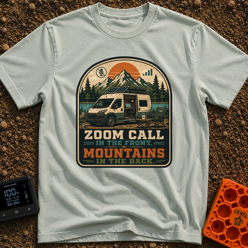 Zoom Front Mountains Back - T-Shirt in Bay - A camper van with an open side door revealing a mobile office setup with a...